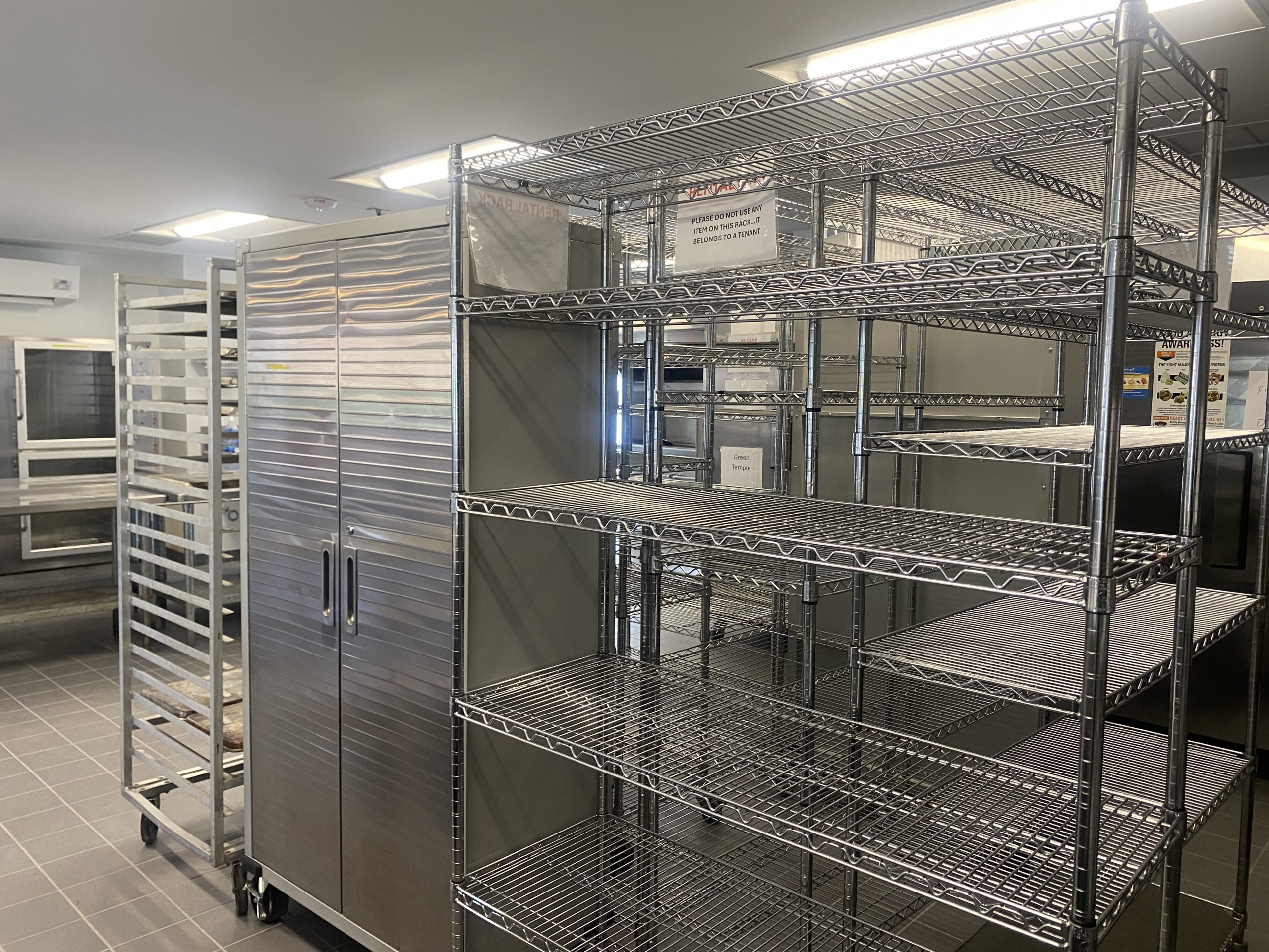 commerical kitchen at commonwealth autism all abilities innovation and inclusion center with silver shelving and commercial grade refridgerator